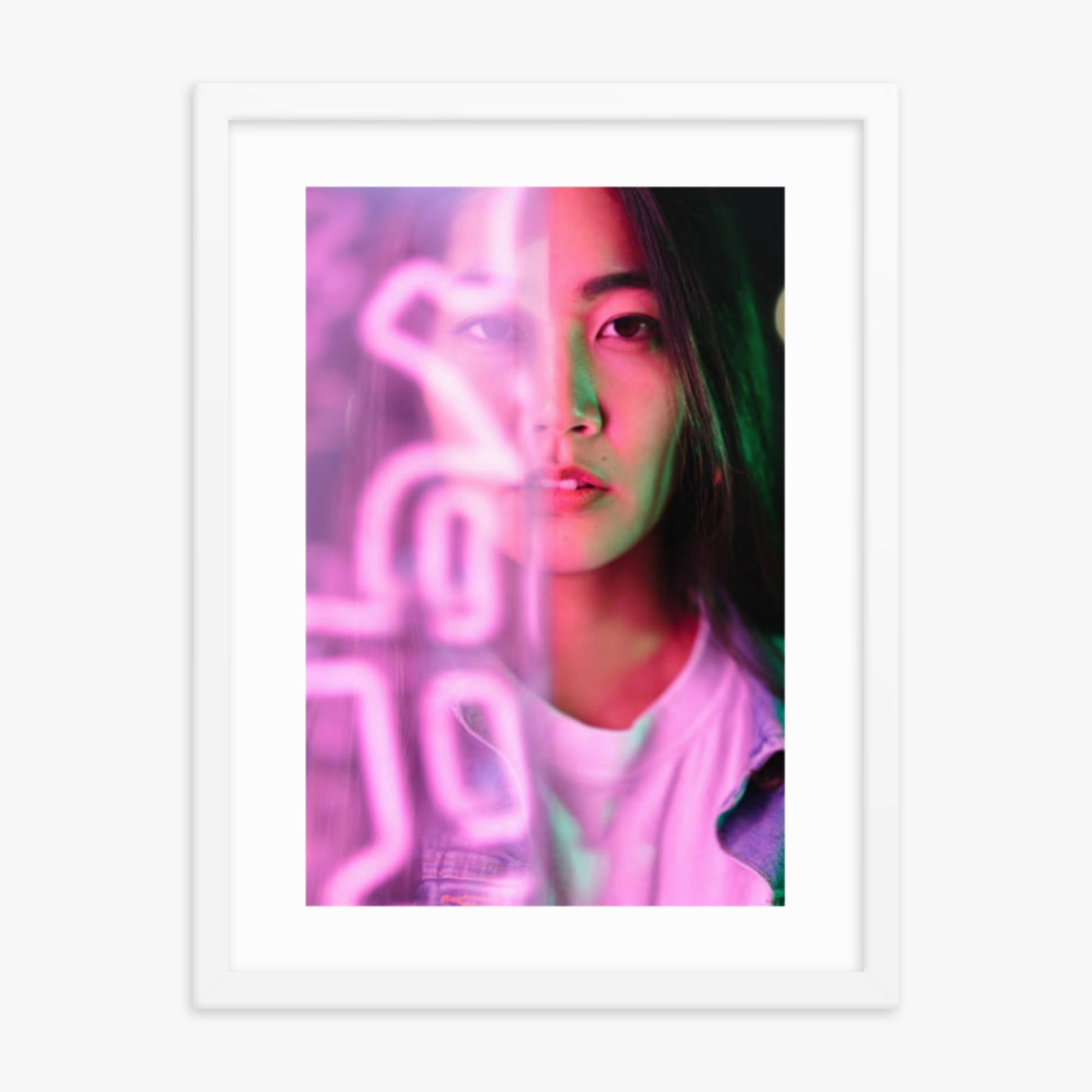 Portrait of young woman lit by pink neon light 18x24 in Poster With White Frame